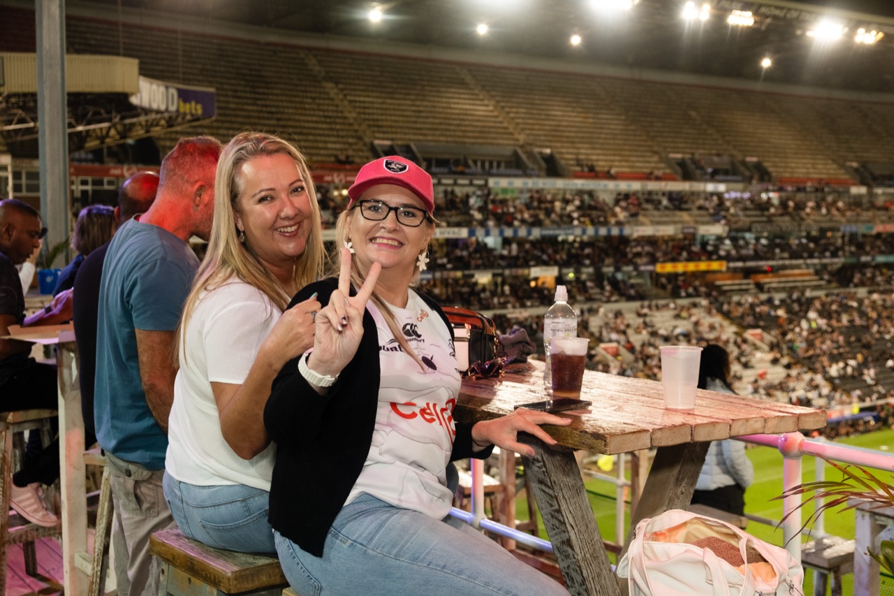 Guests at a deck table overlooking the Kings Park pitch